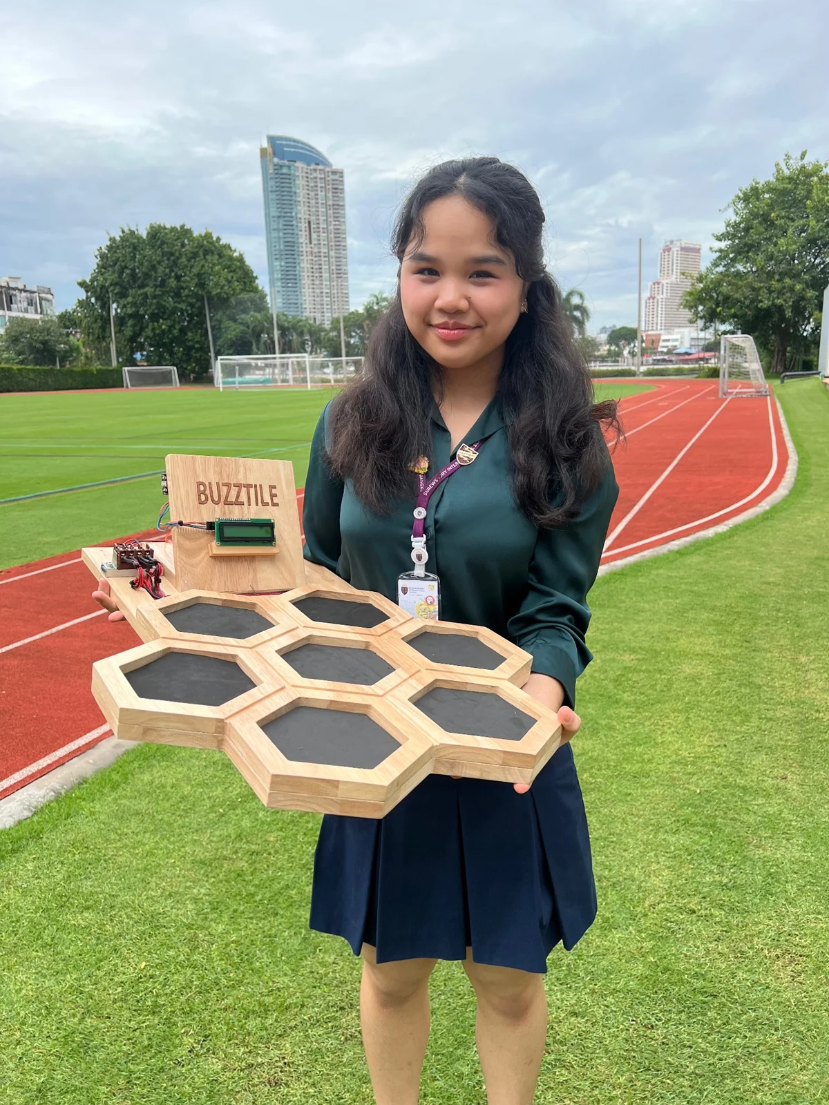 Bua with the completed BuzzTile prototype